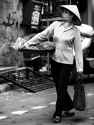 Merchant on a street in the old quarter of Hanoi in February 2007