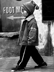 As Hanoi is a very plouted city many people walk around with respirator masks. Even small childs learn to wear them.