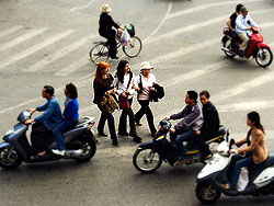 It is unusual for Europeans to learn the way to cross a street in Vietnam.<br>The rule is: Walk slowly and don't stop walking whatever happens.
