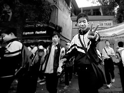 When classes are over the pupils can't wait to get outside.<br><br>Schools have up to 3000 pupils in Hanoi with class sizes of about 60 pupils.<br><br>School next to the St Joseph church in Hanoi, Vietnam.<br>February 2007