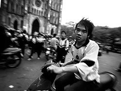 Another pupil leaving school on hi smotor scooter.<br><br>School next to the St Joseph church in Hanoi, Vietnam.<br>February 2007